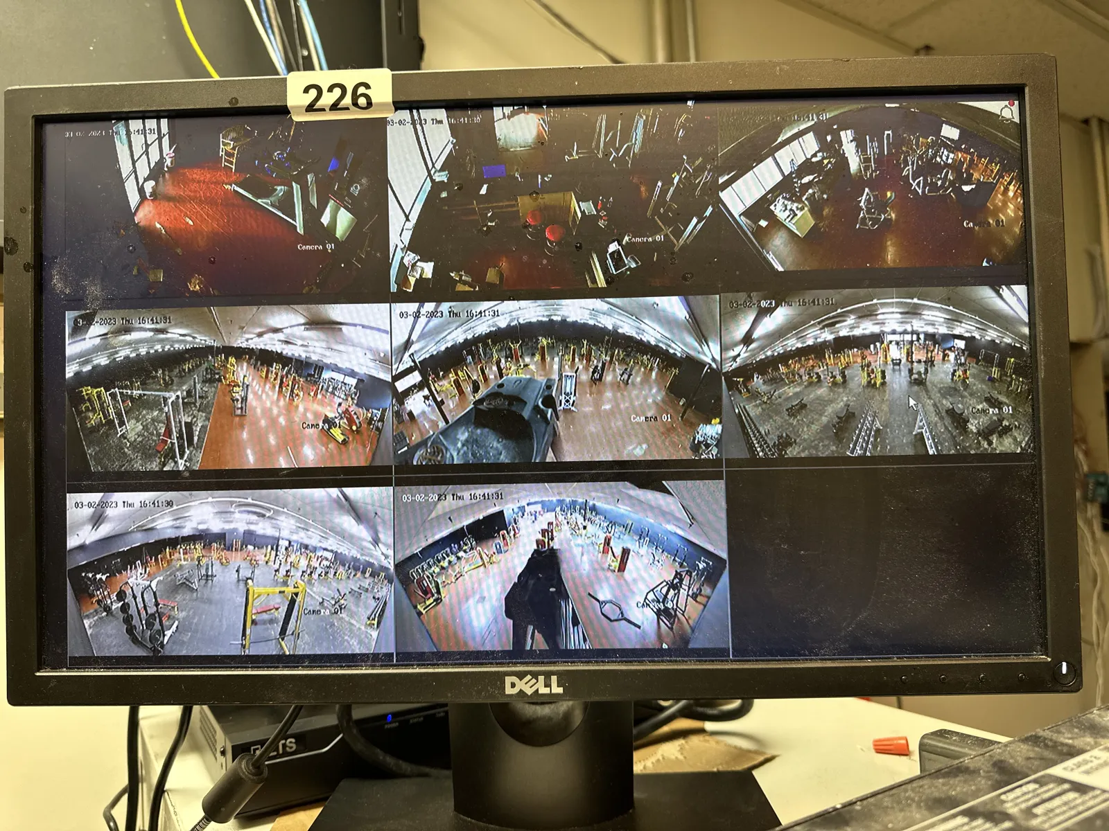 Monitor showing multiple indoor security camera views